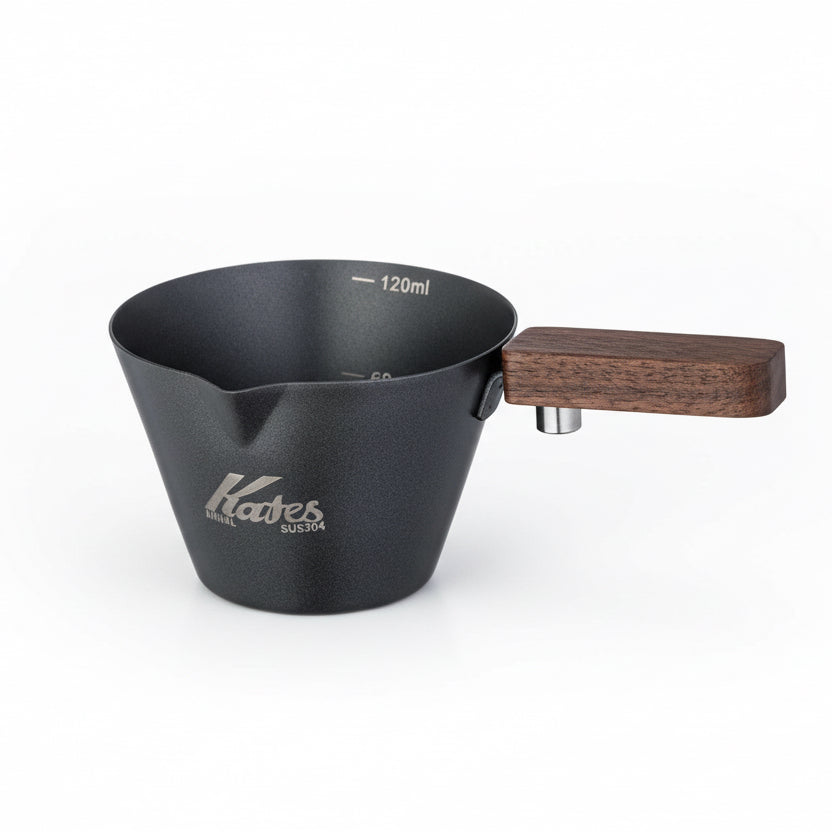 Black measuring cup with wooden handle and 'Kates' branding on a white background